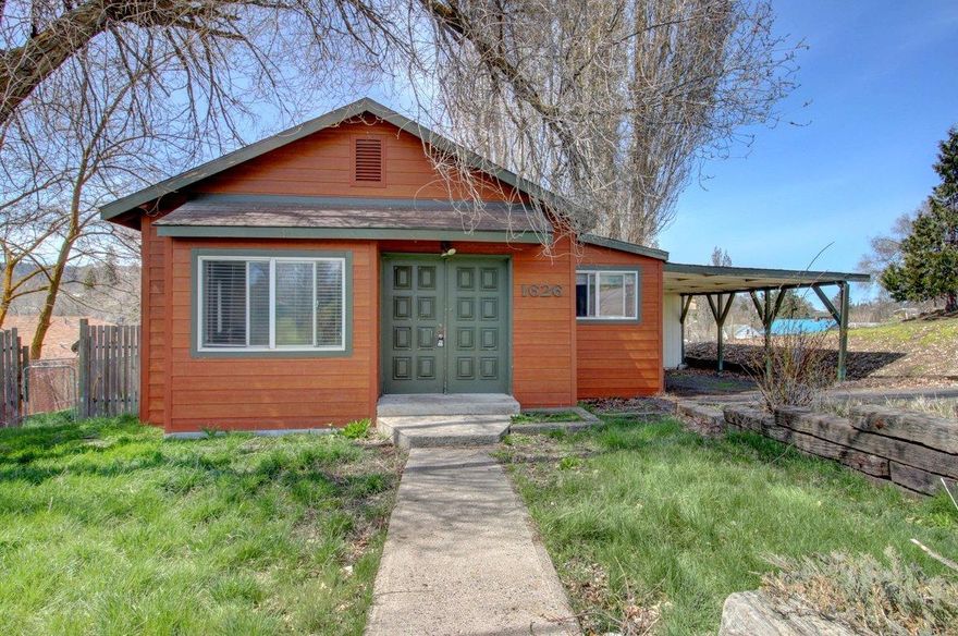 This adorable home is ready for a new family or would make a stellar rental property! Situated in a quiet neighborhood with no through traffic, you will feel right at home. The 2 bedroom, 1 bath home offers a huge master with ample closet space & a large open living room with an abundance of natural light and a gas wood stove! The backyard is enormous and fully fenced with a large deck & mature shade bearing trees! The kitchen is spacious with an eat in dining room and offers plenty of cabinet space. Don't miss your opportunity to own this wonderful home!