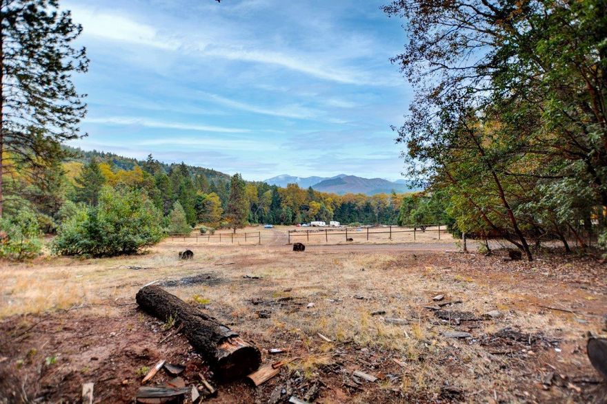 This 5.96 acre mountain treasure is ready to build your dream home! The property is zoned RR5, the septic is installed, there is underground electricity, and the well is drilled. The last well flow test was 5.2GPM with a 1,500 gallon holding tank. The home site is approved, driveway and pad are in and there is a 24' x 24' older out building of little value. Live in the privacy of the mountains and still just minutes from town. Bring your vision and see the potential this rare opportunity offers!