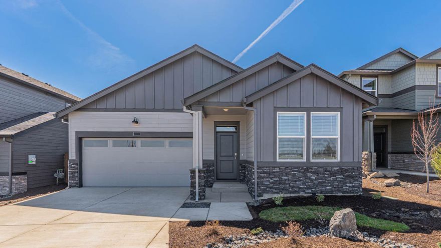 Special rate and closing cost incentive with use of builder's preferred lender!!  Call for details!!  Move in ready! Visit Stevens Ranch in Bend, located near Reed Market Rd in a serene residential area with access to outdoor living and adventure, the city, and historic downtown Bend. Move in ready!! The Spruce is a functional 1,435 sq. ft., one-level 3 bed 2 bath floor plan with Smart Home Technology included! The two front bedrooms are centrally located between a full bathroom. The stylish kitchen has stainless-steel appliances, quartz countertops, full height backsplash, pantry, central island, and a gas range/oven. The dining area flows into a light and bright great room with a cozy fireplace, ideal for entertaining. Primary bedroom includes a walk-in closet, en suite with double vanity, and extra storage. Sales office hours are 10am - 5:30pm daily. Photos are representative of plan, features/specs may vary!