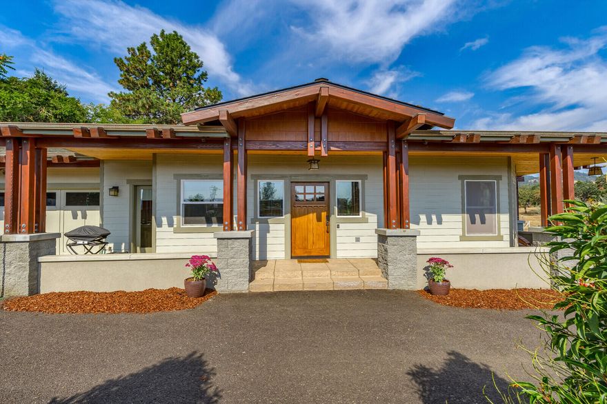 Searching for a home in town in Jacksonville with a country feel? You need look no further - this is it! Tucked away at the end of a quiet street, this one of a kind, 2 bedroom plus an office craftsman-inspired home was custom designed and constructed especially for the owners with impeccable attention to detail. Craftsman touches include  beautiful tile gas fireplace surround and a tile wall behind the cooktop. The kitchen features gorgeous granite counter tops and kitchen island, lots of quality cabinetry, a walk-in pantry, and  charming built-in eating nook. This home has solid wood paneled doors, wide hallways, a fire suppression system in the ceiling, & tons of storage. The lovely master bedroom suite includes a huge walk-in closet and a large bathroom with soaking tub and separate roll-in shower. Relax and enjoy the out-of-doors on the porch, patio or sitting area outside the 2nd bedroom. Enjoy views of the hills and pasture land from almost every window in this perfect location.