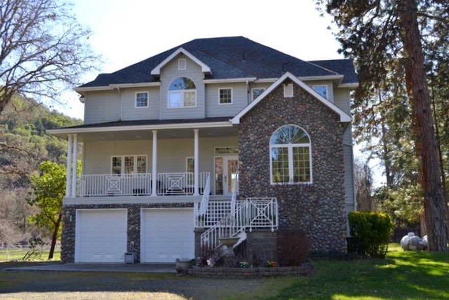 How Much? River Front Estate with multitude of features for an amazing low price. Gorgeous chalet style home with two master suites both and views of the flowing river from every window. All built to the finest standards and quality. The water views are breathtaking. The land is all level and usable with approximately 2000 feet of Rogue River frontage. Set up for horses with a professional horse barn with 6 stalls with office/caretakers quarters over and a beautiful garden area. There are water rights for 6 acres of irrigation. The property is its own world close to everything inside the private fenced compound that allows you to rest and let the peace of water front living in Oregon change your life. Excellent value for this amazing price.