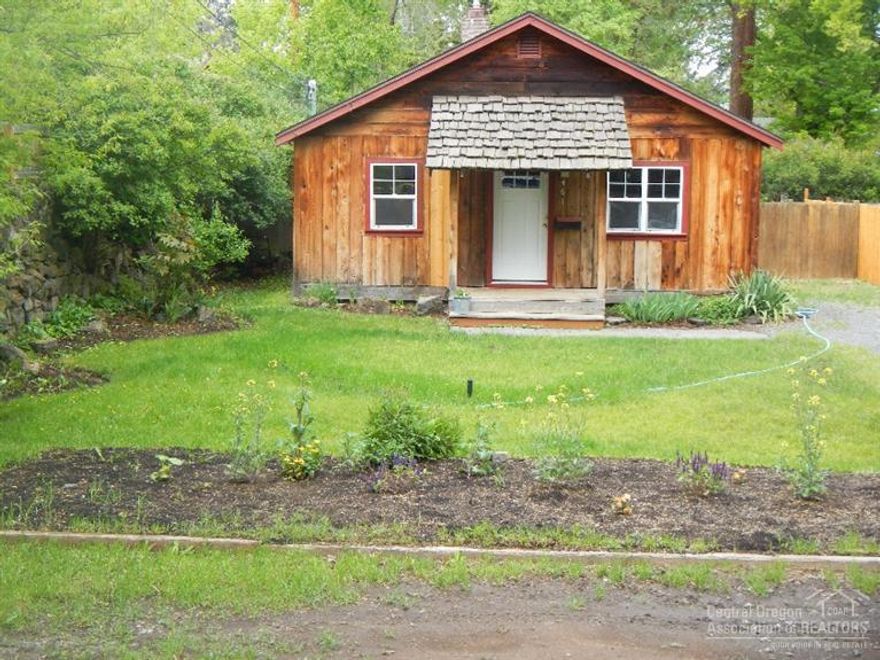 Quaint Westside cottage not in historical district. Lot is zoned RM. Adorable inside, all new floor coverings, kitchen, bathroom updated, new vinyl windows. Amazing location. City code would allow an ADU or a second remodeled dwelling.