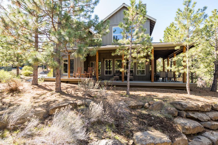 This updated private home in River Wild at Mt. Bachelor Village is perfect for a primary residence, second home or investment property.  Low maintenance, quiet living in a community with access to trails, the Deschutes River, a pool, clubhouse and hot tub area located on the way to Mt. Bachelor or just minutes from Bend's downtown, Old Mill District or all of the exciting restaurants and shopping popping up on the west side of Bend.  This home's open floor plan is great for entertaining and features a covered wrap around porch, a main level primary suite with 2 bedrooms and a bath on the upper level.  The kitchen was recently updated with quartz countertops, new stainless sink, and full height backsplash, the exterior was painted in 2020, and a private paver patio was completed in the back of the home.