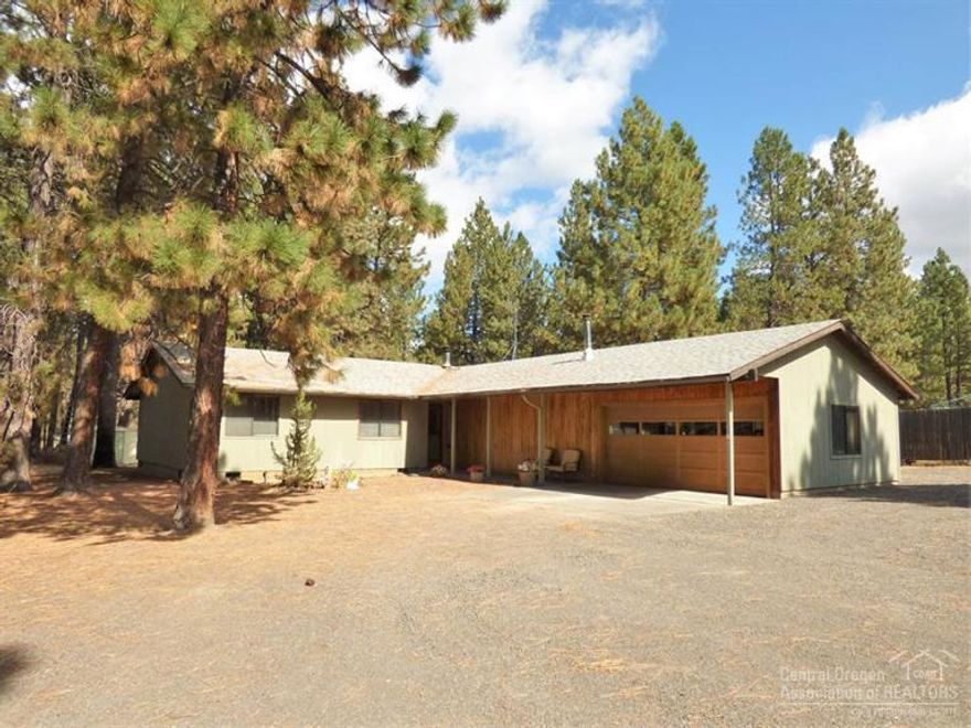 Nice single level home on 1.15 acres with lots of room for all of your recreational vehicles and much more. Big 24'x 20' covered RV parking, 2 sheds, 2 car garage with 800 sq. ft. shop area. Wonderfully maintained by the same owner for over 30 years. New carpet, interior paint 3 years ago, roof in 2002 & exterior paint in 2006. Good working kitchen, updated appliances, wood cabinets, pantry, breakfast bar & ample counter space. Great setting with large 20'x 20' back deck, old growth Ponderosa trees.