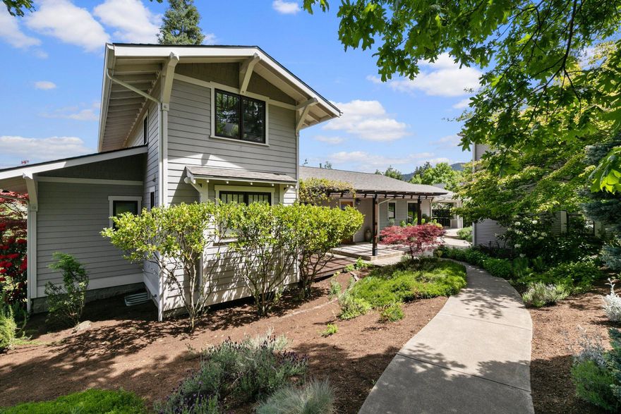 Gorgeous contemporary house above the Oregon Shakespeare Festival, and just a couple blocks to restaurants, shops and Lithia Park! The spacious .63 acre property has wonderful views of Grizzly Peak and consists of two oversized lots both with alley access. The house was custom designed and built for the current owners in 1995 and features 2,321 sf on a .39 lot. The very well maintained house features a main level primary suite, spacious carport, two story carriage garage, extensive decking, oak floors, private office, and a new roof installed in May 2022. The vacant .23 buildable lot adjacent to the house is included at the listed price and may be kept for added privacy or sold separately. Rogue Planning and Development Services performed a site evaluation and many additional options exist for further lot partition or development of ADUs or cottages.