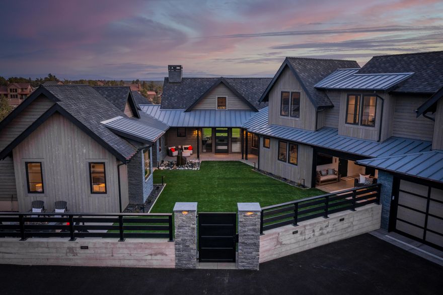 With an expression of pure style this home comprises a spacious open floor plan and crisp interior design. With relaxation and entertainment in mind contemporary elegance surrounds you. The Fully Furnished turn key home opens with a steel gate to a courtyard boasting a luxurious level of comfort with artificial turf, fire pit and indoor/outdoor living space that leads to the impressive fountain and front entry. Inside the combination of light and space compliments the architecturally outstanding home featuring a star-burst ceiling, raw steel fireplace, waterfall island and inset molding. The craftsmanship shines through in the grain matched custom cabinetry, built ins, Custom steel Range Hood and barnwood touches. Smart home, Crestron system, automatic blinds, and multiple Washer/Dryers. Over 6 bedrooms with personal bathrooms, multiple lock out suites and a detached Casita/Hobby Room with loft. All sitting on the hillside overlooking the 10th Tee Box and Fairway in Brasada.