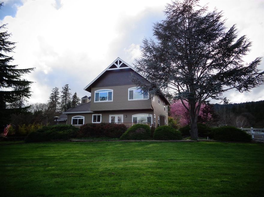 Come view this beautiful home in desirable West Hills, Old Stage Road area. Mountain View Estates. Completely remodeled from ground up in 2005. 1.84 acres with MID GRAVITY FED irrigation rights! Beautiful views of Mt. McLaughlin, valley and city lights. Home has 3 bedrooms and 3.5 baths. HUGE master suite overlooking the valley with separate seating area, walk in closet, and huge master bath with dual shower heads and a large soaking tub. All bedrooms have coffered ceilings. Living room has gas fireplace with beautiful custom mantel and travertine tile surround. There is also a secondary living room / family room area with full bath. Beautiful kitchen and baths with granite counter tops. You will love the outdoor spaces and the huge wrap around deck, perfect for summertime entertaining! Detached shop area is large enough for riding lawn mower, motorcycle or even a small compact car. Close in country, convenient to Central Point, Medford and historical Jacksonville!