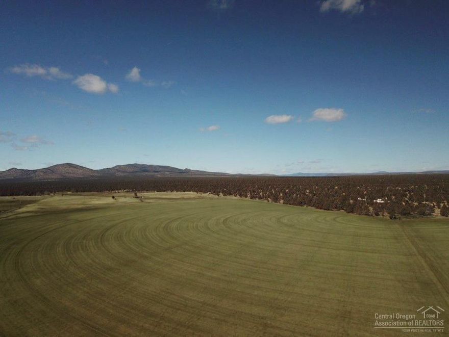 Here's an amazing opportunity to build the ranch or farm of your dreams! 281 total acres with 203 acres of irrigation. All 203 acres of water is delivered form three Valley pivots. With several excellent building sites that feature amazing Cascade Mountain Views, a small feed lot and a livestock well. This property also adjoins BLM. Currently all three pivots are in very good seeding of grass that are very productive for both hay and/or pasture.