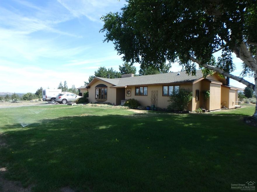 This ranch home built in 1971 has 2.85 acres with views of the Cascades with over 2,000 sq. ft. provides you that open space you crave yet close into town with easy access to Redmond, Prineville as its located in the South side of Madras. With 3 bedrooms, 2 baths and a double fireplace you get that old school warm, cozy home with some room to grow if needed. Plenty of room for that garden, maybe a new shop for those hobbies, storage of RV, Boat and more.