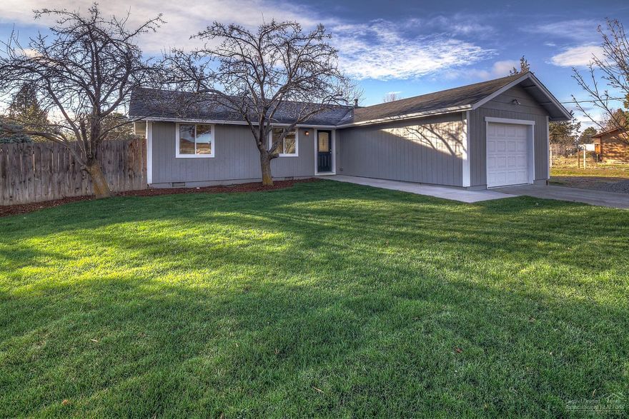 Fantastic turn key home on nearly 1/2 acre lot in town! All NEW everything - roof, siding, windows, paint, cabinets, granite, wood stove, flooring, sidewalk, patio, this list goes on! Build your shop here and enjoy having elbow room while just minutes from amenities. Kitchen features a movable Island with extra storage & seating. Front yard is landscaped w/sprinklers, back yard is ready for creativity. Garage floor w/epoxy finish & new door. Huge lot w/like brand new home makes this an easy property to love