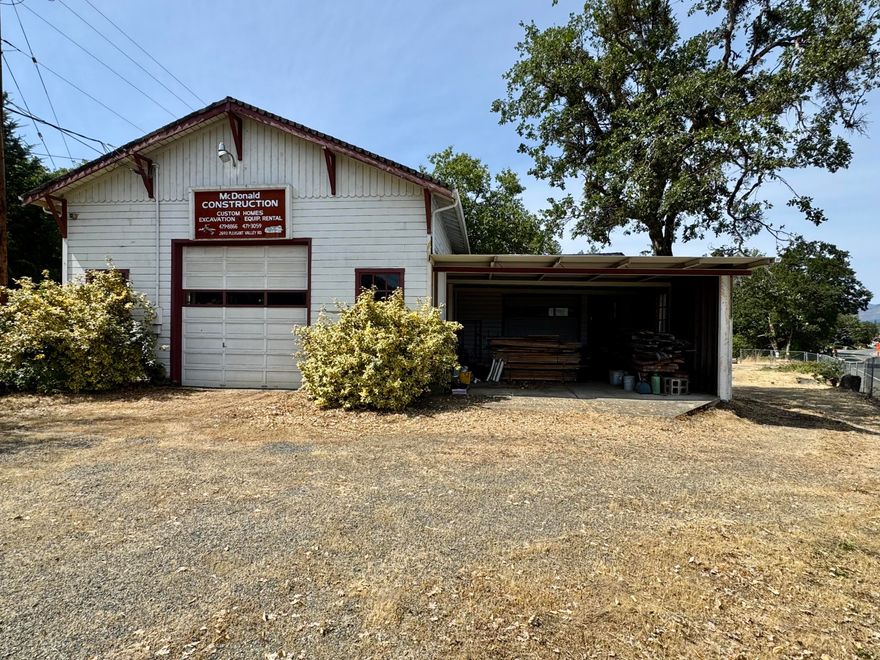 Hard to find Rural Industrial building at the corner of Pleasant Valley Rd and Monument Drive in the North Valley.  Amazing main shop building with 16+ft ceiling & tall roll up door, heavy duty hoist on steel rails the length of the bldg.  Lots of power including 3 phase to run many types of machines.  Additional side shop room with 12+ft ceilings & roll up door opening into large carport style area with slab floor.  A bedroom area, kitchen area, and 3/4 bath room as well.  Building and property being sold ''as is''; buyer to perform their own due diligence.  All information is deemed reliable but not verified; anyone considering purchasing this property should perform theri own investigation into the uses and condition of the property.