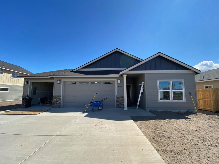 COMING SOON! Affordable luxury built by Dunlap Fine Homes on the Bend side of Redmond w/Cascade Mtn Views. Spacious living both inside & out, w/plenty of room for entertaining. Vaulted Great Room plan w/open Kitchen, tons of cabinetry & prep space on the slab Quartz counters. Neat & tidy full height tiled back splash, SS appliances & farm sink. Living space offers a cozy corner Gas burning fireplace w/stylish accents & room for gathering. Desirable Master separation, walk in closet, step in shower, tiled floors & dual vanities. 2 additional guest rooms off the entry w/full bath. Laundry room w/storage & folding table too! Durable wood look laminate flooring, carpet in the bedrooms & tiled baths. Gas forced air, A/C & back patio. Triple garage, gated RV parking, fully fenced, front landscaped w/auto sprinklers. There's still space in the back yard for a tiny home/ADU, workshop or?  8 unique plans in this community - still time to select finish packages on other homes!