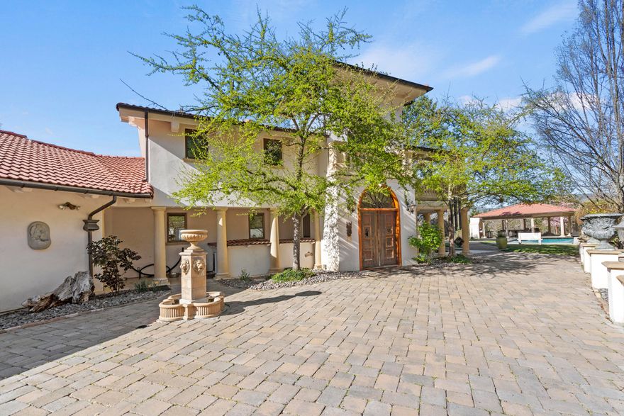 Operated as a successful Airbnb, this 80-acre villa overlooks the valley & Emigrant Lake with privacy and elegance.The 4 en-suite bedrooms captures the stunning views.The chef's kitchen is a showpiece with an oversized island, honed granite, double ovens, prep sink, heated & refrigerated drawers, 3 dishwashers, custom cabinetry and an 8-burner Wolf range.Black Walnut floors throughout, complemented by hand-forged iron railings, marble & tile finishes & 8' solid wood doors.Upstairs is dedicated to the luxurious master suite with a spa-inspired bath, dressing room & an adjacent sitting area framed by a wall of windows. Copper windows, doors & gutters enhance the home's timeless design.Outdoors is equally impressive with an inground pool, expansive paver courtyard, kitchen, restaurant-grade pizza oven & fireplace. Morel highlights incl a hot tub, greenhouse, enclosed raised-bed garden, 1.7 acres of Riesling grapes, tasting studio, 15,000 gal water tank, fruit trees & parking for 10 cars.