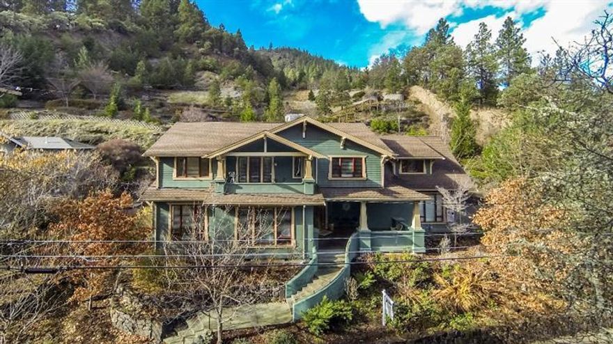 Lithia Park home custom designed & built in 2005 with all the classic charm & character of a vintage craftsman but featuring all the modern conveniences of a new home. Close to downtown Ashland. The 4590SF home is 2 levels with an elevator. The welcoming front porch leads to a custom mahogany craftsman door with stained glass surround, mahogany flooring and a pleasing soft color palette with lavish amounts of vertical grain Douglas Fir woodwork. Relax in the family room, library, wine cellar or enjoy a movie in the media room. The chef's dream kitchen features dual fuel Wolf range, Miele dishwasher, Sub-zero refrigerator, granite counters & much more. There are 4 beautifully appointed bedrooms including a guest en-suite w/private entry. The master suite is a retreat with a sitting room, gas fireplace, covered patio overlooking the park and a lrg bathroom with heated travertine tile, Arroyo Craftsman lighting, custom walk-in closet w/ a skylight and custom built-ins.