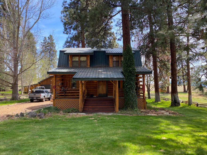 WOW ! Look at this wonderful Log home in Oregon Shores !  3 bedroom 2 .5 baths   Two separate living areas, one on the main floor with a woodstove,  and one in  the daylight basement . Bedrooms are located upstairs and in the daylight basement. No bedrooms on the main level. Hardwood floors throughout and the home has been maintained meticulously. 
Wonderful kitchen and a  formal dining room.  Enclosed back sunroom off the kitchen. 
Beautiful landscaping, Inground sprinklers front and back.   Drive through RV garage  PLUS another drive through car garage that can park LOTS of cars.3 garage door openers,  and loft storage. This home has access on Elkwood circle for back entry