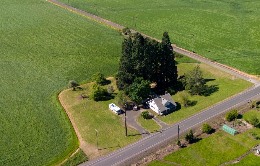 Discover your legacy farm in the heart of Willamette Valley! This 126.87-acre farm has non-canceled water rights covering all of the tillable farmland.  Approximately 120 acres are currently leased/farmed to the end of the season. The charming Craftsman home with 5 bedrooms, 3 bathrooms, & a detached workshop is a great start for a remodel or a solid rental.  Positioned directly in the path of progress, adjacent to the city limits & minutes to Eugene, this property is an excellent investment for the future!
