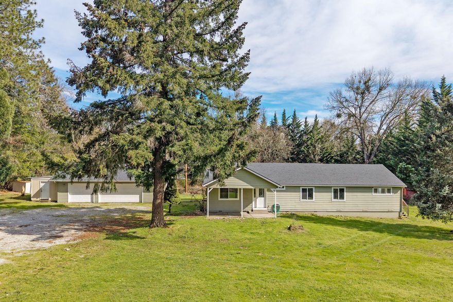 Nestled in a country setting with room to breathe this nicely updated home offers perfect blend of modern comfort and peaceful privacy. New vinyl plank flooring, and fresh interior paint throughout. Primary suite with new flooring, lighting, & updated bathroom w/ new cabinets, countertop, faucet, mirror, toilet, showerhead and flooring. Kitchen has white cabinets, new black leathered granite countertops, breakfast bar, & new stainless steel appliances including range/oven, dishwasher, & microwave. Guest bedrooms and baths are refreshed with new flooring, lighting, fixtures. The laundry room includes white cabinets, new flooring, paint, water heater. A half bath is also updated. Exterior upgrades include a new Roof, Exterior paint, and Garage Door Opener. The spacious 3-car Garage/Shop is ideal for hobbies or storage. This home offers the privacy & freedom of country living w/ all the benefits of a move-in-ready home where you can enjoy the outdoor space and lovely setting.