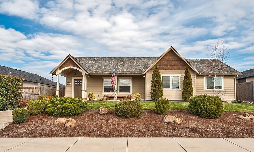 Beautiful Craftsman style single level home in search of a new owner. Built in 2009 but shows like new. 3. bed 2 bath 1590 sqft. The open concept great room/kitchen/dining room with vaulted ceilings is family friendly with upgraded flooring and paint. The kitchen features a large island/bar, granite counter tops, custom cabinets and spacious pantry. Inside laundry room with additional storage. The master suite is also vaulted with a sense of space with slider to the backyard, nice walk-in closet and bathroom. Wonderful covered back porch for relaxing or BBQing.. Fenced, sprinklers and mature landscaping. 2 car attached garage. Great curb appeal / front entrance with covered porch is very inviting... You won't be disappointed.