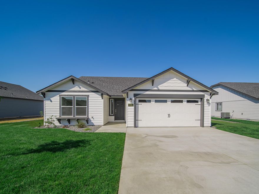 NOW SELLING CANYON RIDGE PH 5! 
The 1408 square foot Edgewood is a mid-sized home catering to those who value comfort and efficiency in a single level home. An award-winning designed kitchen, featuring a breakfast bar and ample counter space, overlooks both the spacious living and dining rooms. The separate main suite affords you privacy and features two large closets in addition to a dual vanity ensuite. The two sizable bedrooms - one of which may be used as an optional den - share a full bathroom and complete this design-smart home plan.  RV Pad included!   Photos of a similar home & not indicative of included features.