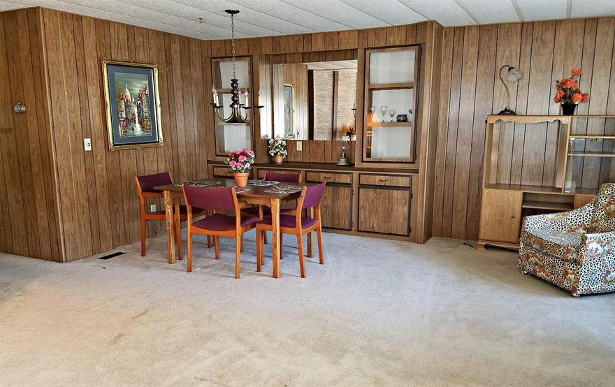 Here it is! Your 2BR/2BA mobile home in a 55+ senior park approx 2 blocks from the Rogue River! Inside the home, ample light flows through several large double pane windows. Checkout the built-ins in the adjoining dining area! A well designed kitchen opens into a separate family room with slider access to the covered patio. The 2nd BR with attached BA leads to the laundry room. The master bedroom has double closet and a master bath that has a step up platform for the garden tub and a separate shower. Outside is a covered 2-car carport and a metal shed for additional storage. With a full price offer, you can have all the appliances: the oven/range, fridge, microwave & washer/dryer. Need space for your RV? There is a separate area for RVs for an additional fee! And, the Park offers an outdoor banquet area, an indoor game room, and even a small library. Don't forget to talk to the Park Manager about the number & type of pets you have.