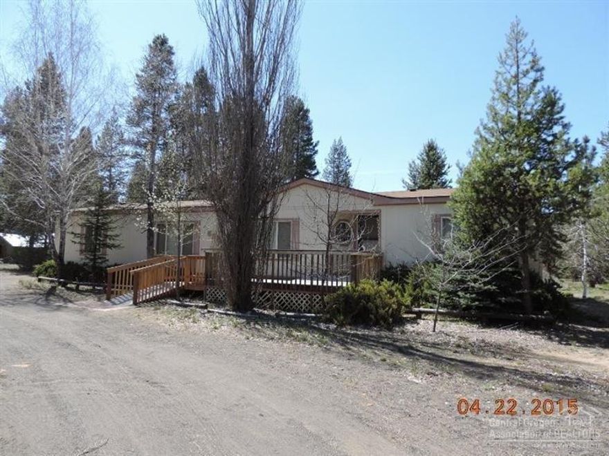 $14,000 price reduction! FANTASTIC square footage and a full 3rd bathroom right off the back door & utility entry. Vaulted ceilings, open floor plan w/kitchen pantry & built-in hutch. Skyline Home w/OVERSIZED 24X36 2-car garage/shop on fully fenced & gated acre of land with mature landscaping. A bit of TLC and/or updating will be needed to make it sparkle once again, but the bones are all there, just a little elbow grease and VOILA!