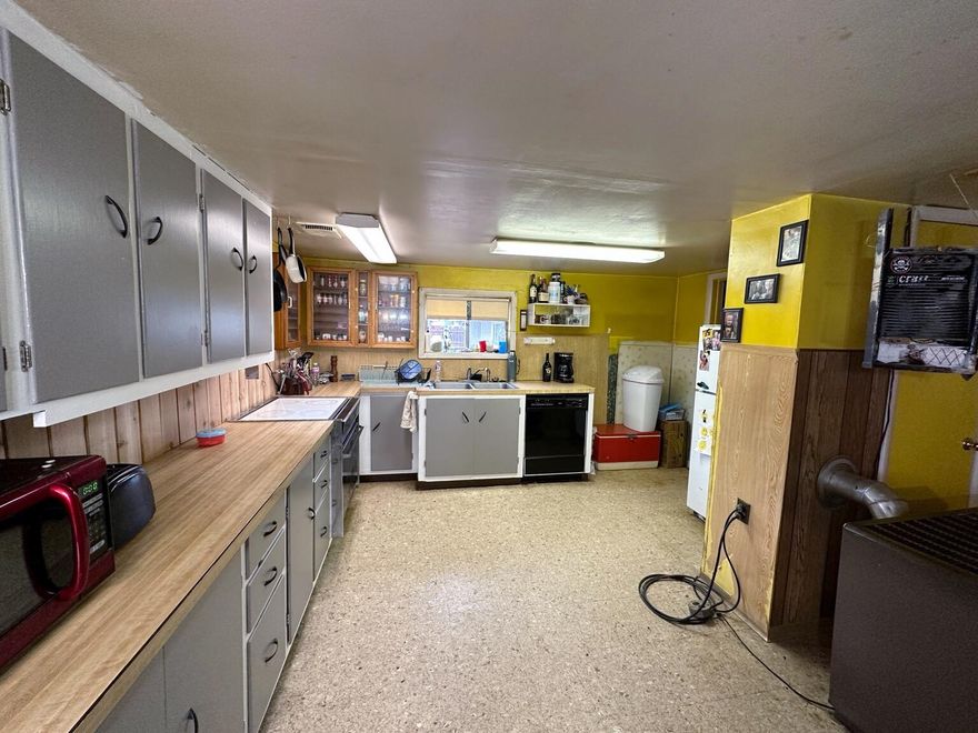 INVESTORS and BUILDERS!!! Large .20 acre lot in town.  2 bedroom 1 bath  home with a detached garage. Property is complexly fenced and gated. Great yard perfect for a large garden.