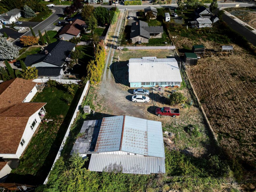 Tucked back from the main road for added privacy, this fully fenced property sits on just over half an acre and is filled with potential. The manufactured home offers a great opportunity for renovation or redevelopment, making it ideal for flippers, investors, builders, or anyone looking for a property with upside. The value is in the land — a mostly level lot with plenty of space to build, add a shop, ADU or customize to fit your vision. Located just minutes from town and .5 miles from Fruitdale elementary school, this property combines convenience with peaceful surroundings. Don't miss your chance to bring new life to this well-located property!