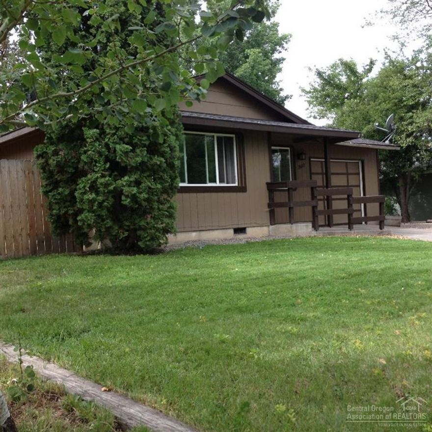 Recent Updates. Modern style home w/walnut type laminate flooring throughout & fresh trendy color inside & out. Living rm has in-wall wiring for entertainment center. Kitchen is a chef's delight: under-cabinet sink, solid surface counters, insta-hot & top of the line appliances. French doors from the mst to back yard Attached, insulated garage, nicely landscaped w/ u-g sprinklers, garden shed, fenced yard with RV parking on a quiet street. Perfect starter home or investment opportunity. Close to SW 27th