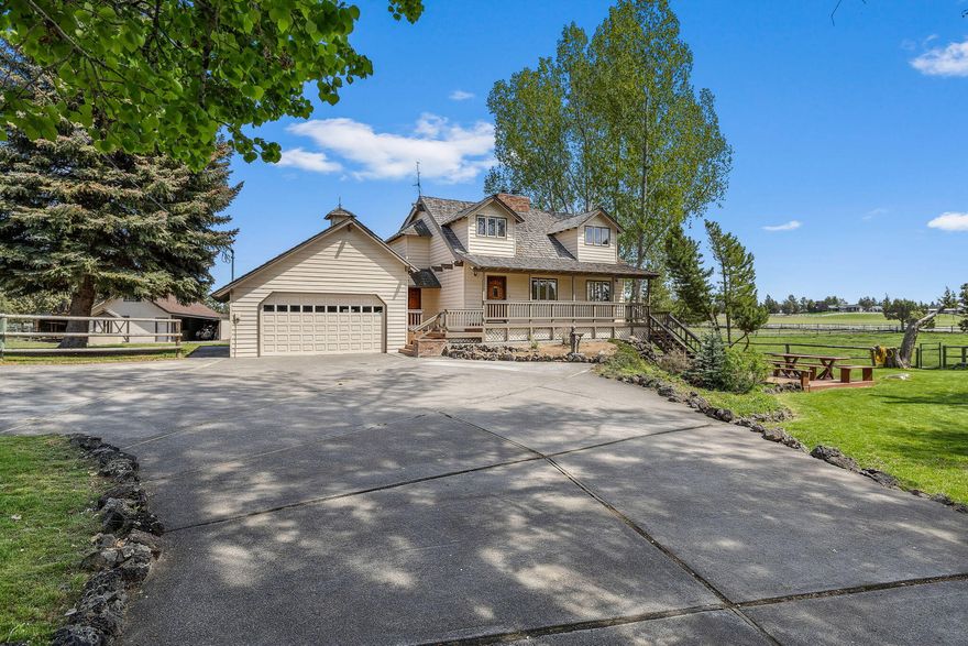 Beautiful acreage property in NE Bend! Custom-built home on 8.73 irrigated acres just minutes from Bend's vibrant East Side. Thoughtfully priced to give you room to personalize and update, the property blends classic craftsmanship with endless potential.
With 3,582 square feet of living space, you'll find warm wood accents, exposed beams, hardwood floors, vaulted ceiling, and views of green pastures from nearly every window.  Step outside to enjoy  the park-like front yard featuring a large pond stocked with fish and framed by mature cottonwood, willow and fruit trees. Fully fenced and cross-fenced, the property includes a 480 SF barn/workshop and is zoned MUA-10, and may allow for the addition of a 900 SF ADU (buyer to verify). Brand new irrigation pump. Plenty of room for a home  based business or multi-gen living with ample parking. One mile to the Bend airport. 3.6 miles to hospital and Mtn View H.S One year home warranty included!