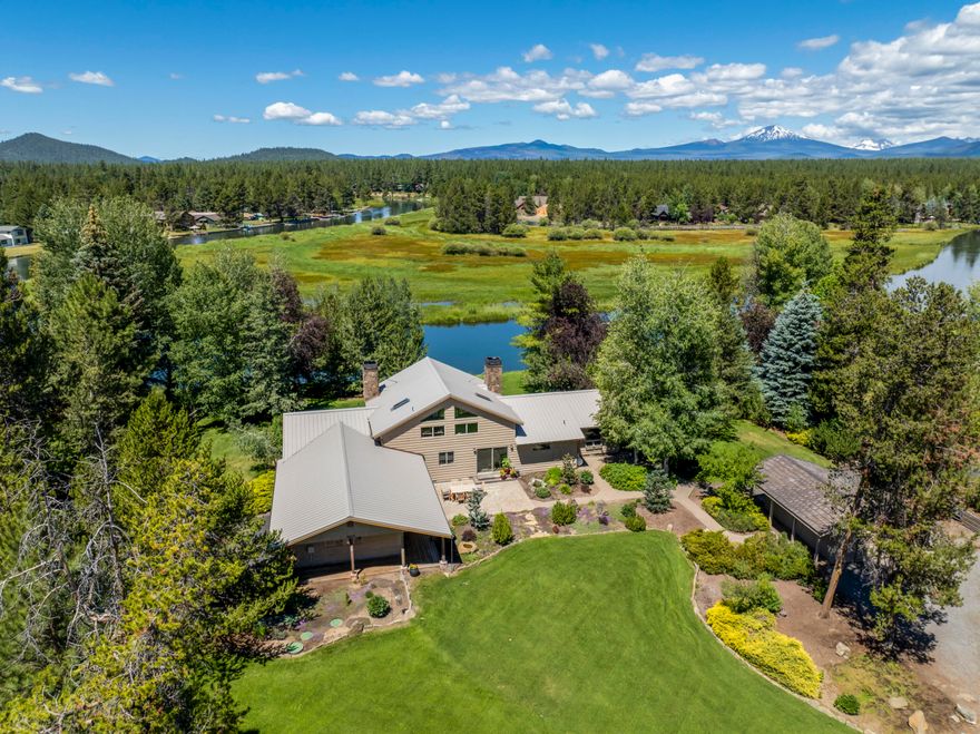 This exceptional, private single-level residence offers 3 BD/3 BA spread out across 3,115 SF and situated on 9 + acres, including a large pasture with a picturesque barn. Residents enjoy sweeping views along the Big Deschutes River as well as snow-capped Mt. Bachelor. The property is part of an exclusive community of  7 homes, with protected marshlands across the river ensuring ongoing scenic views. property is unsurpassed when it comes to wildlife viewing creating a harmonious balance between nature and tranquility.  Bring your horses or alpacas, they will feel at home too.  Inside this home you will find no flaws! Inside, each room offers panoramic views, including the oversized primary suite featuring a Vermont Castings wood-burning fireplace, spacious sitting area & direct access to the backyard, river, & hot tub. This property presents an outstanding opportunity to enjoy both refined living and natural beauty. Let the photos do the talking as you discover this fabulous property