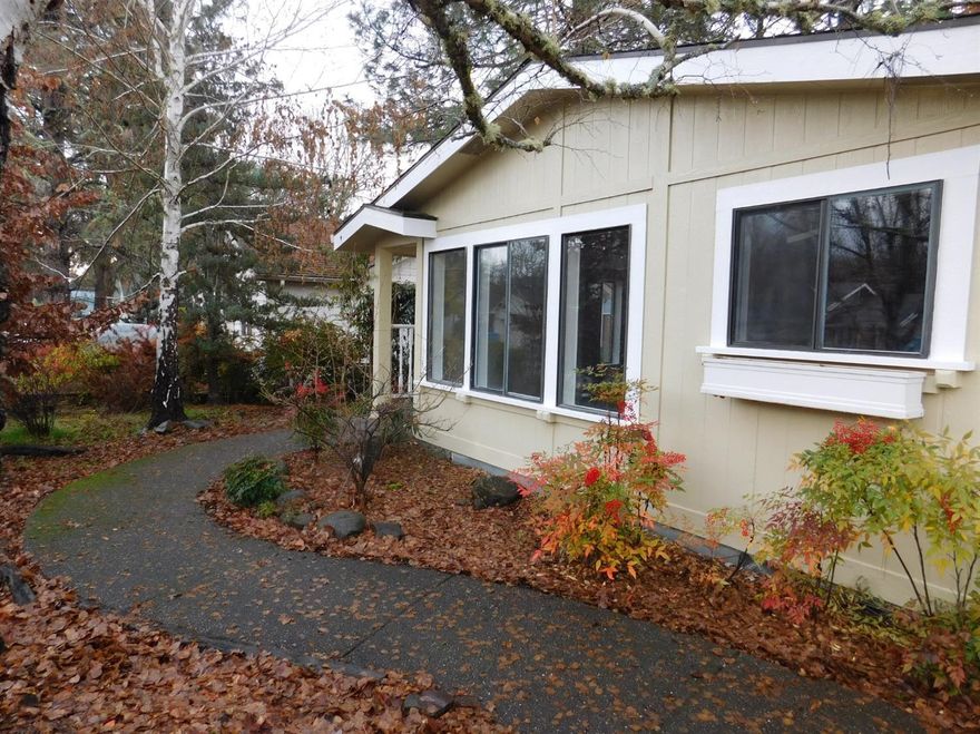 There are many features to appreciate in this Shady Cove home! Immediately walk in to an open plan living in the main living spaces, ideal for entertaining. Take in the abundant natural light throughout the entire house thanks to large windows, vaulted ceilings, and many skylights. This 1989 Fuqua manufactured home also has many recent updates, including new interior paint and new flooring throughout! The master suite offers a large walk-in closet and jetted tub. Enjoy the backyard and patio surrounded by mature landscaping.