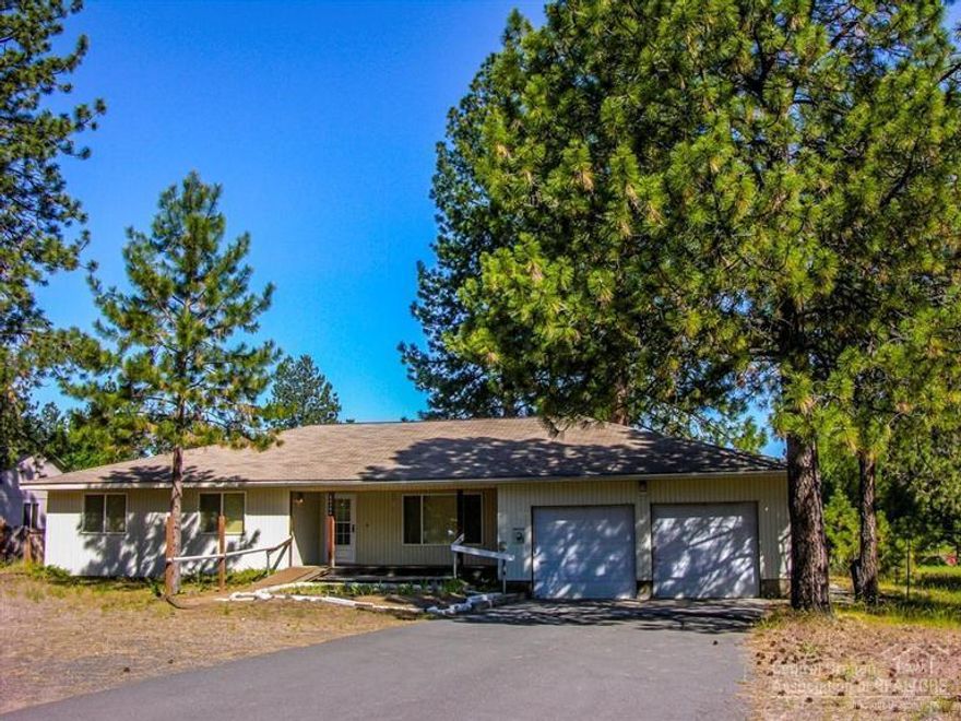 2000sf Custom SW Bend Home & Oversized Garage + Shop on Almost an Acre! This 4Bd/2.5Ba w/large Ponderosa Pines on a 0.91 acre lot w/paved drive features: Large great room, open dining area, big kitchen w/instant hot water, pantry w/pull outs & large b-bar, Laundry room w/half bath, Spacious master w/dbl vanity & shower stall, attached 2+ car garage & 16x24 detached shop w/slab floor & power, covered front porch & covered back deck w/large back yard boasting lots of beautiful mature ponderosa pines!