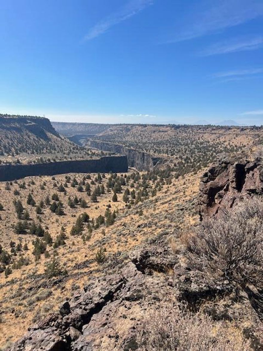 Ideal getaway spot or long-term investment property. If quiet and privacy is what you seek, this is it in these four parcels! Close to the Deschutes and Crooked River, the recreational property adjoins the Crooked River grasslands - making it a wondrous spot for hiking, camping, fishing, hunting, ATV riding and solitude. Nice, natural landscape with must-see Crooked River canyon rim views and numerous Cascade Mountain views from different areas on the property. There is a rustic cabin on the property as well as a storage shed and custom rock sauna. Property is partially fenced with unimproved road for access. Rare find!! ACCESS RESTRICTED DURING WET MUD AND SNOW CONDITIONS.
