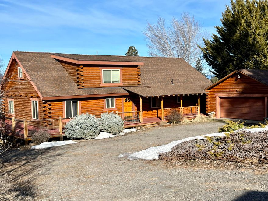 Two story log home with views of Agency Lake and the Mountains.  Master Bedroom with shower, tub and walk in closet.  Galley style kitchen in Great Room and Dining Room- one big area.  Smaller laundry room and office area.  Open loft upstairs with bath.  Detached garage.