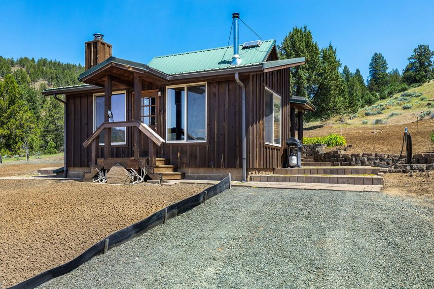 Once in a generation chance for historic homestead. Close-in but secluded hunters paradise with habitat for deer, elk, coyote, grouse, quail & turkey. 377 acres with perimeter fencing, 4 developed springs, corral, state highway access via 3 approved sites.
The property features rolling hills with mixed conifer/juniper stands and pasture with grassy uplands above basalt cliffs. Multiple potential homesites, improved good quality gravel all weather roads.
1870's log cabin lovingly restored to cozy modern standards. Full foundation, solar lighting, 1200 gallon spring fed cistern, gravity fed to Cabin. Full bathroom, with beautiful porcelain clawfoot tub & shower. Approved standard septic system installed. 
Bonus features: Jotul wood stove, knotty pine Great Room w/huge picture windows and Fuego wood furnace, new propane refrigerator & enclosed outdoor shower with panoramic views.
All improvements have appropriate mechanical, plumbing, septic, building permits.