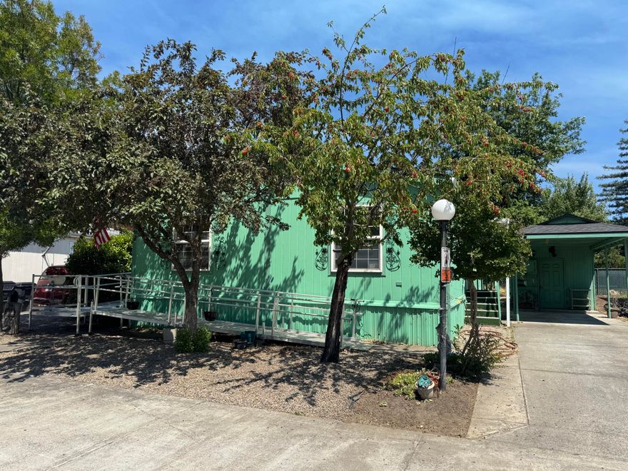 GREAT FLOOR PLAN! ADA Entrance Ramp for easy access. Home was painted 5 years ago, heat & air work well. Home needs some TLC but rear garden and privacy make up for it. The ALL AGE Myra Lynne Park has numerous amenities. Huge pool, Sauna, Clubhouse, library, pool table, commercial kitchen, Overflow RV/Boat Parking, sport court, tennis, playground and lots of green space. On site park managers for easy access. Park is well maintained.