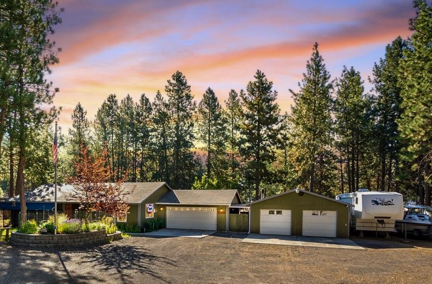 Surrounded by towering pines on just over an acre, this single-level Central Oregon gem delivers the lifestyle buyers dream about. With 3 bedrooms, 2 baths, and 1,704 sq ft of light-filled living space, it's move-in ready yet brimming with potential for your personal touch. Built in 2008, it offers rare functionality with 4 garage bays perfect for a workshop or extra storage and additional covered RV parking. Lush gardens abound, offering privacy and space, while trails, the river, and Bend's dining scene are just minutes away.