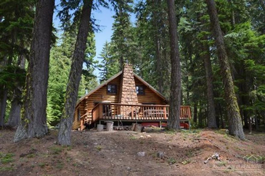 Lakefront Log Cabin with Dock! Classic 1935 log cabin on beautiful Odell Lake. Features three bedrooms, one bathroom, classic rustic furnishings, red fir and slate floors, metal roof and a two-slip dock with recently installed beams and corners. Gorgeous lake and Diamond Peak views. Great four season access. One seller holds an Oregon Brokers License: Mike Mansker.