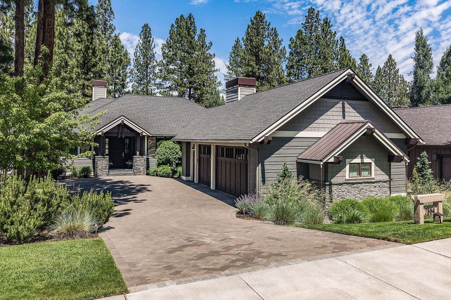 Rare offering in sought-after Reserve at Broken Top. Set on over ¼ acre w/ park-like views, this architecturally refined & updated home makes an unforgettable first impression. The timeless front exterior blends classic lines w/ NW contemporary charm, welcoming you into sunlit interiors designed for comfort & connection. Dramatic great room w/ soaring vaulted ceilings, striking fireplace, rich wood flooring, & an abundance of natural light flowing into the dining area & cheerful gourmet kitchen, featuring a central island w/bar seating, decadent marble counters, 2-ovens, SS farm sink & walk-in pantry.The beautiful views continue into the spacious main-level primary suite, offering bath w/ dual sinks, shower & soaking tub w/ treetop views. 2nd main-level primary suite lies on opposite wing of home for optimal privacy. Lower level inc. spacious family room that opens to back patio & private hot tub patio. Beautiful landscape & tranquil sitting areas extend your living space into nature.