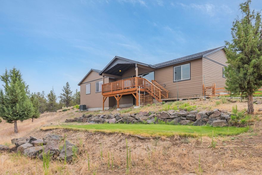 This 2018, single-level home sits on a private 2.0 acres on a quiet cul-de-sac, enjoy the panoramic views of the Ochoco Mountains, beautiful sunsets, and the lights of Prineville from your hot tub and covered deck, and only an 8-minute drive to Wild Ride Brewing, Starbucks, the Prineville hospital, all the privacy of the country but just minutes from the charming town of Prineville and a 15 minute drive to Prineville Resoirver, this property offers the best of both worlds. This beautiful 3 bed, 2 bath house is designed to enjoy the views from nearly every room in the house. Yard is perfect for the avid gardener, and a greenhouse. An extra bonus is the detached and quaint studio/cottage. A large covered back deck allows you to enjoy the views year-round. Landscaped portion of yard is fenced with deer fencing. Plenty of room to build a shop or barn below the home.