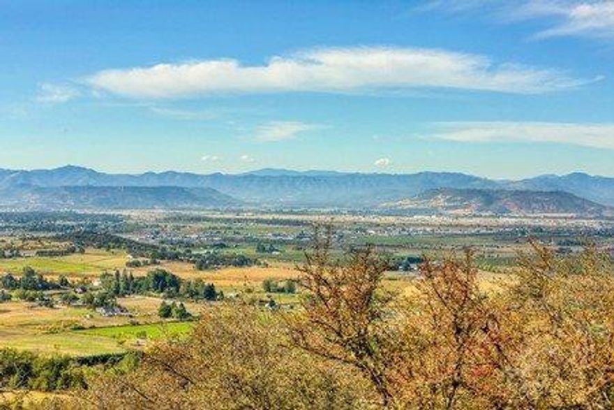 Stunning panoramic views form this 5.5 acre homesite approved parcel in prestigious Roxy Ann Heights gated community. Rare opportunity in this development to build your dream home! Well installed and well log cites 165 GPM over a 2 hour air test! Septic approval obtained. Abraham Lincoln Elementary School, Hedrick Jr. High, and North Medford High School districts.