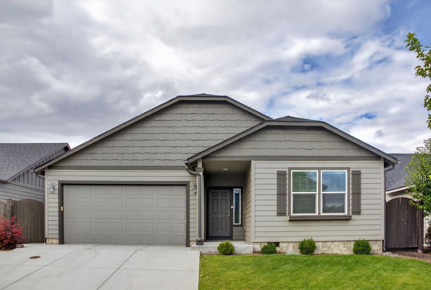 Welcome to Maple Meadows located in a prime NW Redmond location with walking paths, open park spaces and a trail network. This is an efficiently designed and expansive single-level home offering 4 bed/2 bath with an oversized 511 sq ft garage. The Orchard floor plan has a long wide entry opening into the vaulted great room with a gas fireplace. The kitchen includes a breakfast bar with expansive quartz counter space and a generously sized pantry. Enjoy the covered patio with a fully fenced and landscaped backyard. Enjoy central air and gas heating, this lightly lived in and immaculately kept home will surely bring you many years of comfort and joy