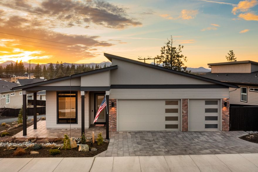 This stunning, single level home on Bend's Westside with tasteful contemporary finishes is in pristine move in condition. Enjoy expansive cascade mountain views from Bachelor to Jefferson from the great room, master bedroom, and elevated composite deck with custom built in gas fireplace. The .21 acre lot is all xeriscape landscaping for easy maintenance with a fully fenced back yard and walking trail along the South side. In addition to the 768 square foot 3 car garage, there is nearly 1000 square feet of dry storage with power under the home with tall ceilings. The location is less than 1 mile to Shevlin Park, 1.7 miles to Northwest Crossing business park & 2.5 miles to downtown Bend. Don't miss the virtual walk through!