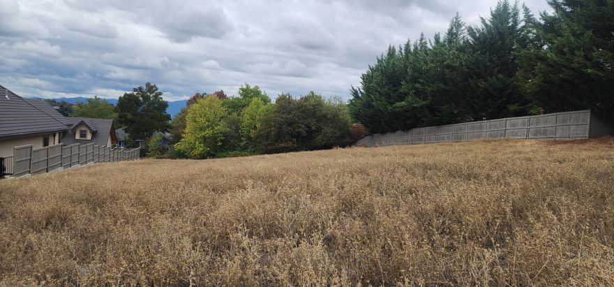 Welcome to the gorgeous Saddle Ridge subdivision, one of East Medford's most desirable neighborhoods!
This .74 of an acre premium lot offers the perfect opportunity to build your dream home surrounded by
the natural beauty of Southern Oregon's rolling hills. Enjoy sweeping valley and mountain views,
peaceful surroundings, and a community of elegant custom homes. The property is located just minutes
from award-winning schools, shopping, dining, wineries, and medical facilities--yet feels like a private
retreat. Whether you envision a modern farmhouse, a luxury estate, this lot offers endless potential in
a truly stunning setting. Don't miss your chance to own a piece of East Medford's premier hillside
living at 5633 Saddle Ridge Drive—where views, value, and location come together beautifully. Don't miss
this awesome opportunity to build your dream home in a dream location! Drive-bys welcome!