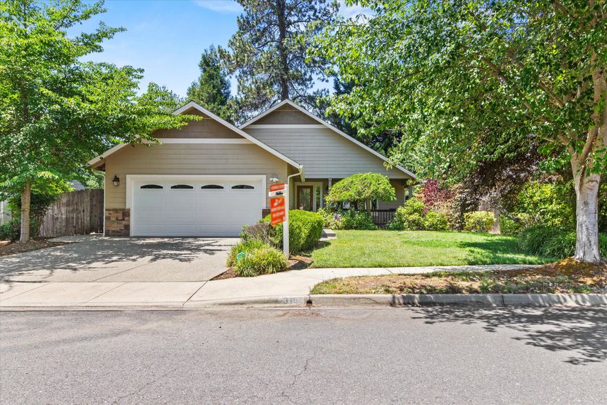 Located in a quiet Grants Pass neighborhood, 316 SW Hudson offers timeless materials and thoughtful updates throughout. Inside, real hardwood floors and granite countertops provide lasting quality and style. The home is surrounded by a fully landscaped yard—both beautiful and low-maintenance—perfect for enjoying Oregon's seasons. Just minutes from downtown, parks, and schools, this home is equal parts charm, function, and convenience.