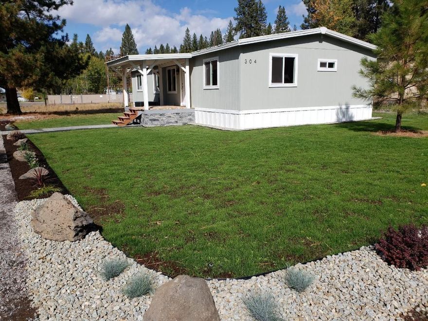 Beautiful home has just been completely updated! It is located in Chiloquin on .68 acre. 3 bedrooms and 2 baths. Updated kitchen with new kitchen cabinets, counter tops and a fire clay porcelain farmhouse sink. New appliances include range, microwave, dishwasher, refrigerator. Bathrooms have been updated with new fixtures, toilets, fans, and vanities. Master bath has a new custom porcelain shower, glass doors. New interior paint and Luxury Vinyl Plank flooring. New lighting, ceilings and door trim. New commercial grade metal roof, new soffit and ridge vent system. New exterior siding, trim and new paint.  New window and exterior doors. New 50 gallon water heater tank, supply side plumbing and valves with new p-traps. New vapor barrier above ceiling. New insulation throughout walls, ceilings and floors. New heat pump, smart thermostat, registers. New Electric fireplace. Foundation has been upgraded to HUD standards with new piers, restraint system, skirting and vapor barrier.