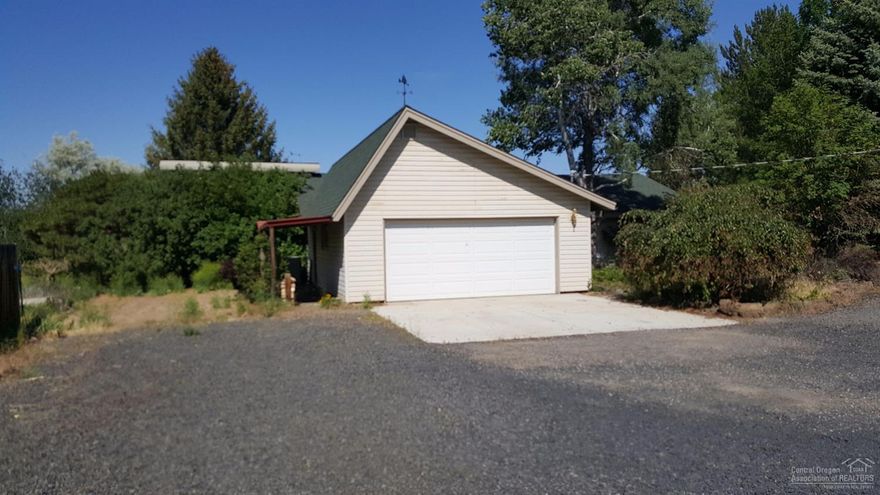 Nearly 10 acre East side farm in desirable McArdle Rd community. 3 bedroom, 2 bath Ranch style home with bonus room addition plus loft office. Cascade mountain views, barn, separate shop/storage/tack building and irrigation equipment. 30,000 gallon below ground level cistern for crop irrigation. Fenced & cross fenced. Property is located adjacent to public land.