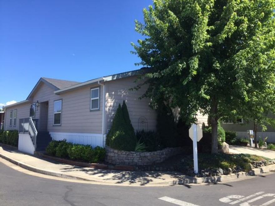 An amazing value for the first-time homebuyer, young family or retirees! This lovingly maintained double-wide mobile home is 1782 sf featuring 3 bedrooms and 2 full bathrooms. Enter the bright & spacious living room with vaulted ceilings, cozy fireplace and handy built-in shelving. Well-equipped kitchen boasts large island, tons of cabinets & overlooks the living area. Large master suite with walk-in closet. Master bathroom features large garden tub, dual sinks, separate shower & storage cabinets. Separate laundry room & detached one-car garage. Located in Meadow View Estates all-family park. Space rent is $556.10/month.