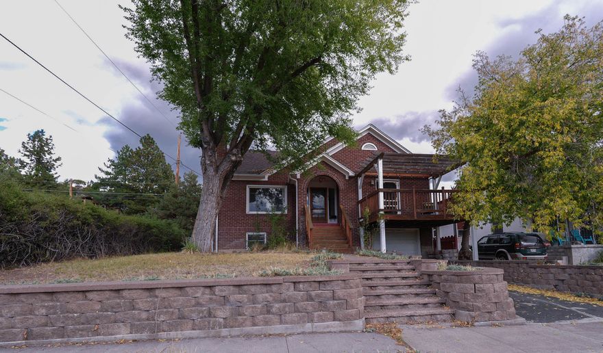 Inviting, charming geothermal home in the amazing Hot Springs neighborhood! This 3 (could be 4 or even 5) bedroom home with 1.5 baths is ready for you to move right in. Character abounds in this beautiful brick home with lots of curb appeal and tons of original charm throughout. Gorgeous wood floors, built-ins, neutral paint coupled with large windows throughout provide a comfortable living experience just minutes from downtown and very close to parks and schools. Situated on a nicely-sized corner lot with detached 2 car garage and also an attached garage, there is plenty of room for parking and projects. Daylight basement is finished and features a bedroom and two other rooms with potential to become bedrooms or other multi-purpose rooms and cold storage room. New roof, back deck & front steps in 2020. Back on market due to no fault of the home. Schedule your appointment today!