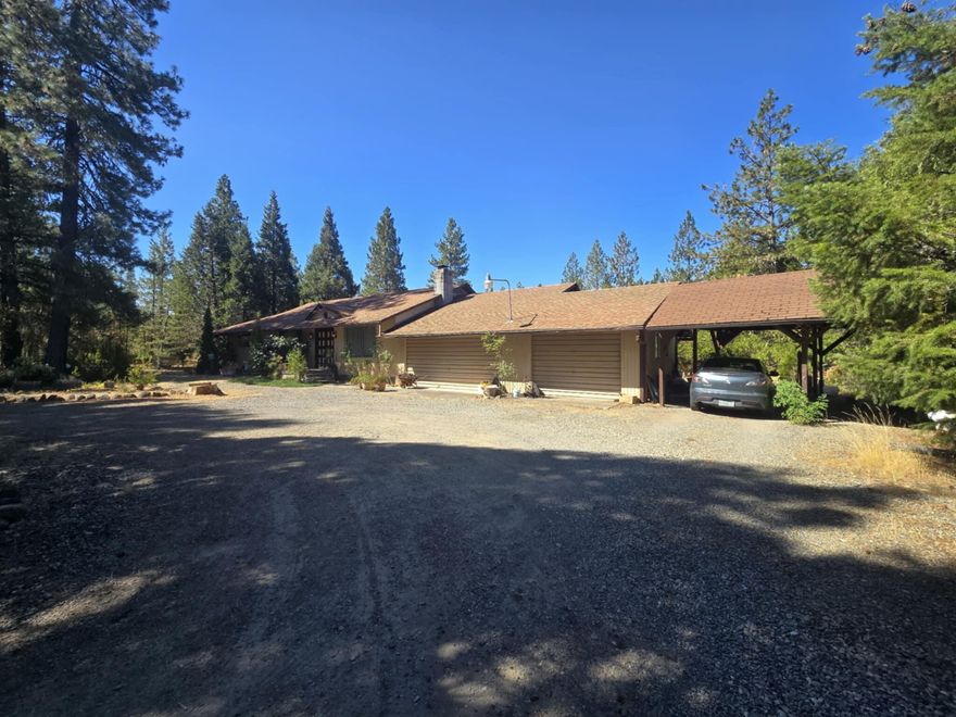 Beautiful Home on 5.07 Peaceful Acres

Tucked away in a serene wooded setting, this charming 1,800 sq. ft. home. Built in 1978, the home sits on a level 5.07-acre parcel surrounded by nature, making it an ideal for those seeking peace and tranquility.

Inside, you'll find a warm and inviting floor plan with spacious living areas and generously sized bedrooms. The home is filled with timeless character and ready for your personal touch.

The property features towering trees, open spaces, and a quiet atmosphere—plenty of room for a garden, animals, or simply enjoying the outdoors.